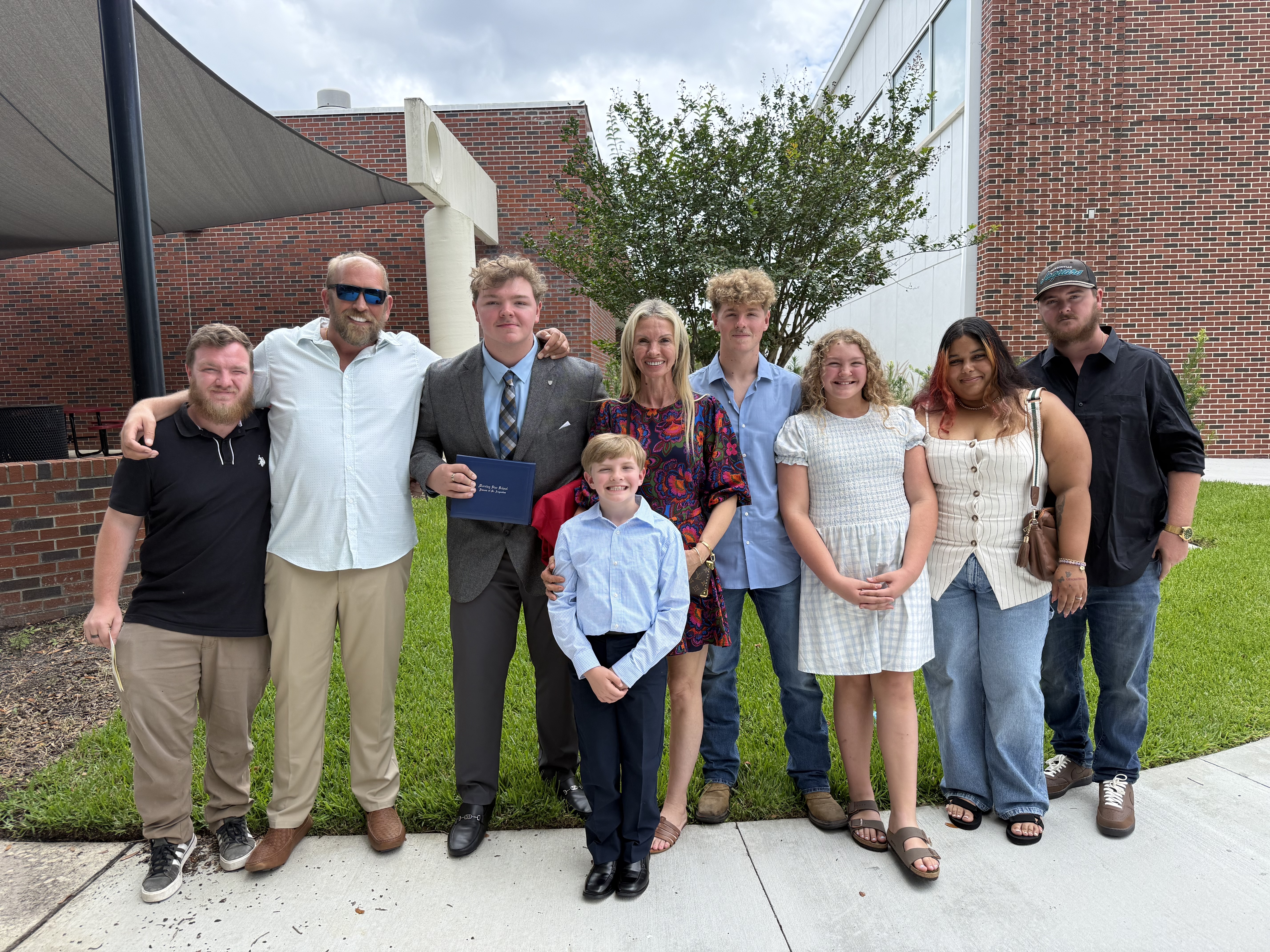 James and Rebecca with their six children — Tracy, Patrick, Cameron, Evan, Hartley, and Simon — the family behind Crash Out Rage Rooms Inc
