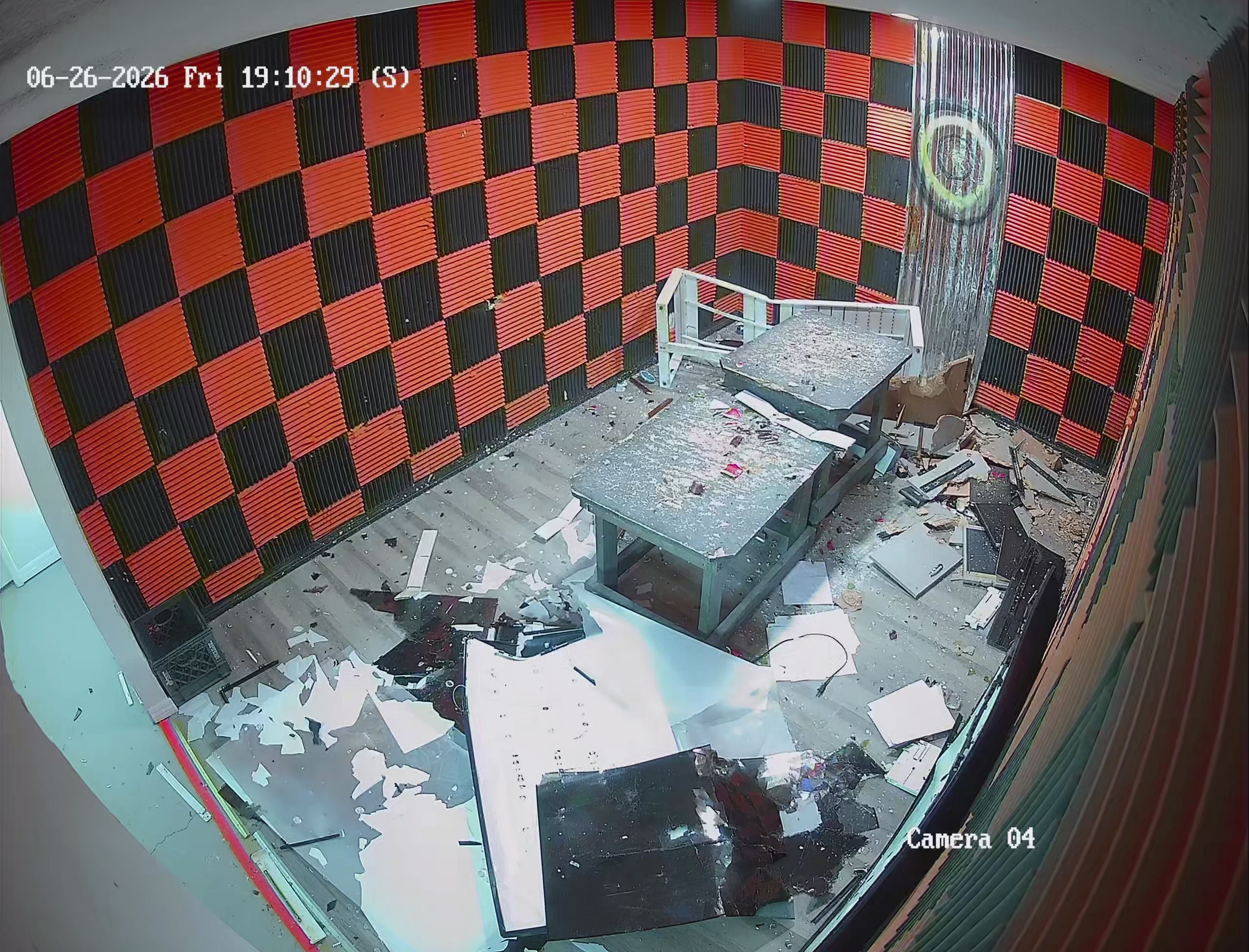 Crash Out smash room aftermath — floor covered in shattered electronics